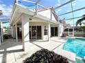 Relaxing pool area with screened enclosure and lush landscaping at 13328 Lake Turnberry Cir, Orlando, FL 32828