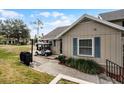 Exterior view of tan house with walkway at 1339 Villa Ln # 50, Apopka, FL 32712