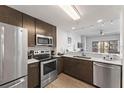 Modern kitchen with stainless steel appliances and ample counter space at 14501 Grove Resort Ave # 3135, Winter Garden, FL 34787
