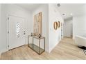 Bright entryway with a console table and modern decor at 1608 Airmont Ave, Deltona, FL 32725