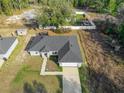 Aerial view of a house, showing its size, landscaping, and surrounding area at 1780 Sw 168Th Loop, Ocala, FL 34473