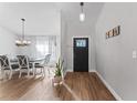 Bright entryway with hardwood floors, showing access to dining area at 1780 Sw 168Th Loop, Ocala, FL 34473