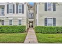 Main entrance to a building with a walkway and landscaping at 239 Longview Ave # 216, Celebration, FL 34747