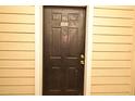 Dark brown front door with a white frame at 2572 Robert Trent Jones Dr # 1231, Orlando, FL 32835