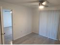 Bedroom with wood-look floors and sliding glass door at 5291 Images Cir # 204, Kissimmee, FL 34746