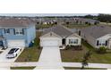 One-story house next to a lake in a new community at 1213 Red Hill Rd, Davenport, FL 33837