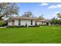 White house with copper gutters and a lush green lawn at 2270 Deloraine Trl, Maitland, FL 32751