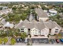 Aerial view of community featuring multiple buildings and parking at 3315 Parkchester Square Blvd # 102, Orlando, FL 32835