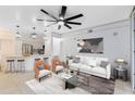Open living room with modern furniture and kitchen views at 3315 Parkchester Square Blvd # 102, Orlando, FL 32835