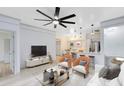 Open concept living room, kitchen, and breakfast bar at 3315 Parkchester Square Blvd # 102, Orlando, FL 32835