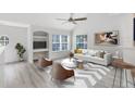 Spacious living room with light flooring and modern furniture at 3433 Soho St # 204, Orlando, FL 32835