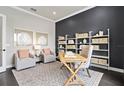 Bright office with large window, built-in shelving, and workspace at 5190 Foothills Preserve Loop, Mount Dora, FL 32757