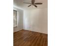 Bedroom with wood-look floors and ceiling fan at 5500 Metrowest Blvd # 101, Orlando, FL 32811