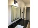 Bathroom with updated vanity, mirror, and fixtures at 718 N Grandview Ave, Daytona Beach, FL 32118