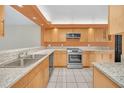 Updated kitchen with granite countertops, stainless steel appliances, and ample cabinet space at 7760 Windbreak Rd, Orlando, FL 32819
