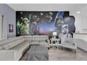 Living room boasts a Star Wars mural and comfy sectional sofa at 9051 Treasure Trove Ln # 301, Kissimmee, FL 34747
