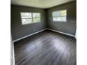 Bright bedroom with new wood-look flooring and neutral walls at 127 W Palmetto Ave, Deland, FL 32720