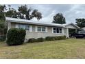 House exterior showcasing a well-maintained lawn at 127 W Palmetto Ave, Deland, FL 32720