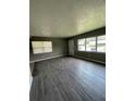 Spacious living room featuring grey walls and wood-look floors at 127 W Palmetto Ave, Deland, FL 32720