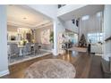 Elegant dining room with chandelier, hardwood floors, and modern decor at 16767 Rusty Anchor Rd, Winter Garden, FL 34787