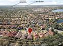 Aerial view showing house location near lake and other homes at 1712 Whitney Isles Dr, Windermere, FL 34786