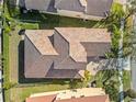 Aerial view of a house with a tile roof and landscaping at 1712 Whitney Isles Dr, Windermere, FL 34786