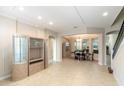 Spacious living room with tile flooring, recessed lighting, and an open layout to dining area at 1712 Whitney Isles Dr, Windermere, FL 34786