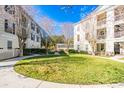 Landscaped courtyard with circular walkway and green space at 231 Goldenrain Dr # 4304, Celebration, FL 34747