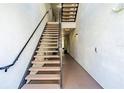Indoor stairwell with modern railings and lighting at 231 Goldenrain Dr # 4304, Celebration, FL 34747