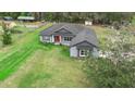 Attractive one-story home on sprawling lot surrounded by mature trees at 30810 Nocatee Trl, Sorrento, FL 32776