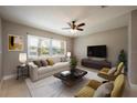 Bright living room with contemporary furnishings and large window at 332 Hidden Lake Dr, Sanford, FL 32773