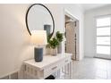 Bright entryway with white console table, mirror, and decor at 4209 Paragraph Dr, Kissimmee, FL 34746