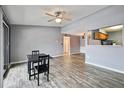 Bright dining area with wood-look floors and a small table at 4605 Cason Cove Dr # 121, Orlando, FL 32811