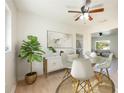 A well lit dining area with a glass table and four chairs at 6150 Medford Dr, Orlando, FL 32808