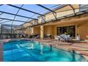 Relaxing pool area with covered patio and spa at 8824 Bengal Ct, Kissimmee, FL 34747
