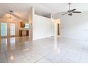 Bright living room with tile floors and a ceiling fan at 936 Gillingham Ct, Kissimmee, FL 34758