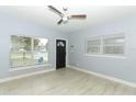 Light and airy living room with wood-look floors and ceiling fan at 992 Carnation Dr, Winter Park, FL 32792