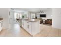 Open concept kitchen with island, granite countertops, and view of living area at 1016 Brooklet Dr, Davenport, FL 33837