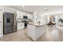 Modern kitchen with stainless steel appliances and granite countertops at 1016 Brooklet Dr, Davenport, FL 33837