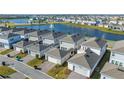 Houses near a lake, showcasing community layout at 14025 Kauai Dr, Orlando, FL 32827