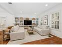 Bright living room with hardwood floors, built-in shelving, and neutral decor at 1641 Lake Baldwin Ln, Orlando, FL 32814