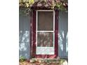 Screen door entry with maroon frame at 1721 Grand St, Orlando, FL 32805