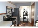 Modern kitchen with stainless steel appliances and wood flooring at 2912 Squire Oak Ct, St Cloud, FL 34769