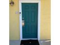 Green front door with white trim and a modern doorbell at 3006 Bonfire Beach Dr # 102, Kissimmee, FL 34746