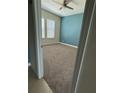 Spacious bedroom with plush carpeting, a ceiling fan and bright natural light at 430 Captiva Dr, Davenport, FL 33896