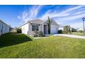 House exterior showcasing a well-maintained lawn and driveway at 613 Greymount St, Davenport, FL 33837