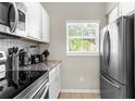 Well-equipped kitchen featuring stainless steel appliances and ample cabinetry at 8558 Crystal Cove Loop, Kissimmee, FL 34747