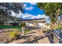 Spacious patio with grill and seating area near the house at 9000 Ogilvie Dr, Orlando, FL 32819