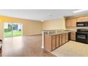 Modern kitchen with ample cabinetry, black appliances, and a breakfast bar at 10125 Shadow Leaf Ct, Orlando, FL 32825
