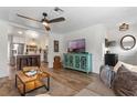 Open concept living space with a teal cabinet and kitchen view at 1926 Lake Sue Dr, Orlando, FL 32803